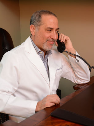 Dr. Morris Hasson talking about his practice on the phone